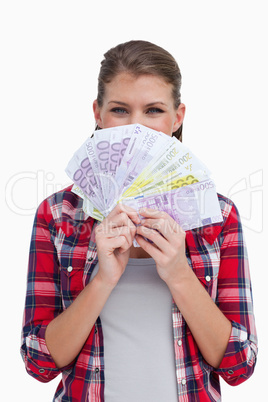 Portrait of a rich woman holding bank notes