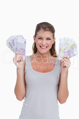 Portrait of a woman showing bank notes