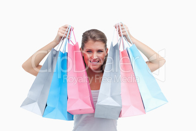 Joyful woman holding shopping bags