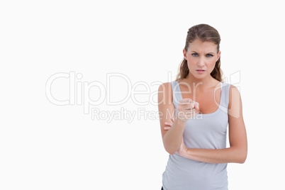 Unhappy woman pointing at the viewer