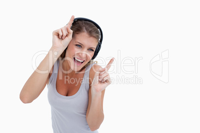 Woman dancing while listening to music