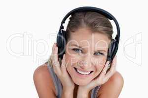 Close up of a happy woman listening to music