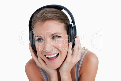 Close up of a smiling woman listening to music