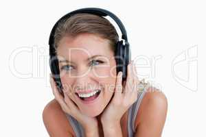 Close up of a smiling woman listening to music