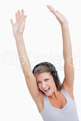 Portrait of a beautiful woman dancing while listening to music