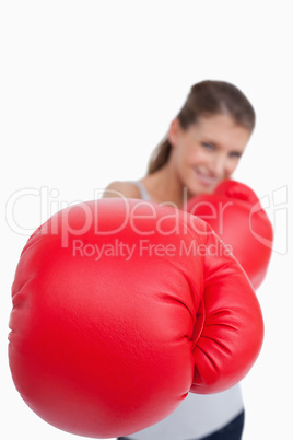 Portrait of a smiling woman boxing