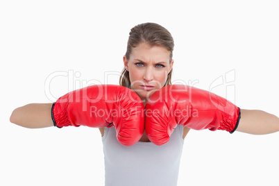 Serious woman with boxing gloves