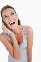 Portrait of a laughing woman making a phone call