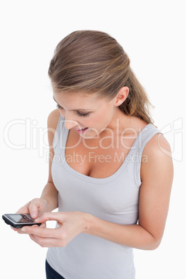 Portrait of a woman reading a text message