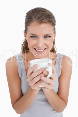 Portrait of a woman holding a cup of coffee