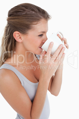 Portrait of a woman drinking a cup of coffee