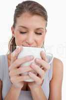 Portrait of a smiling woman holding a cup of coffee