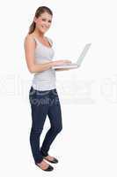 Portrait of a smiling woman using a laptop