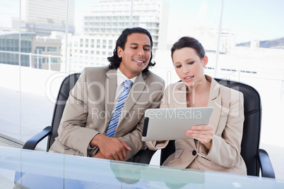 Beautiful business team using a tablet computer