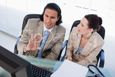 Focused business team using a computer