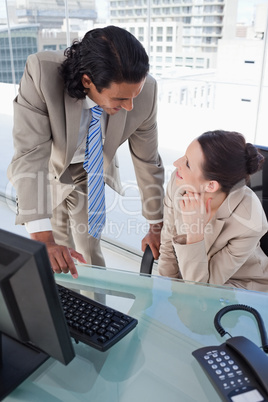 Portrait of a happy business team using a computer