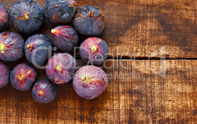 Ripe figs on rustic wooden table