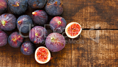 Ripe figs on rustic wooden table