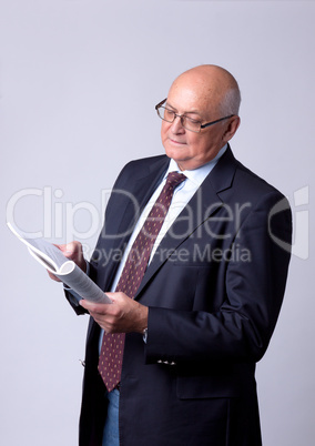 portrait of a successful senior man with book