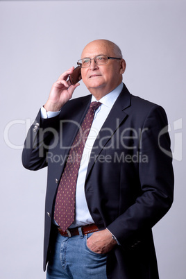 portrait of a successful senior man with phone