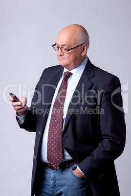 portrait of a successful senior man with phone