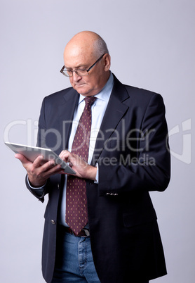portrait of a successful senior man with tablet portrait of a successful senior man with tablet