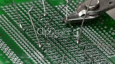 Circuit board lead trimming with cutters