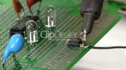 Soldering wire to surface mount IC