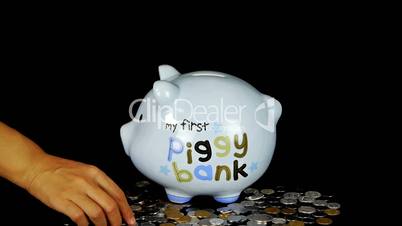 Piggy bank coin drop in black space,Piggy Bank Savings.