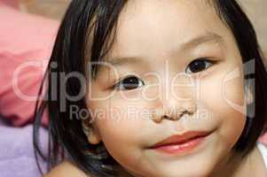 little asian girl with smiling face