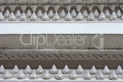 White stucco , thai style on the Wall