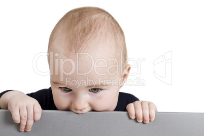 young child holding horizontal sign