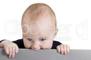 young child holding horizontal sign