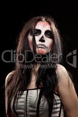 Young woman in day of the dead mask skull face art