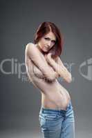 cute young naked brunette girl portrait in jeans