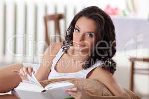 Cute woman read book in morning interior