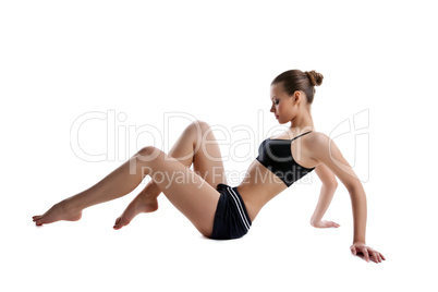 young woman sit on white in fitness dress