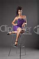 young woman with amazing figure sit on chair