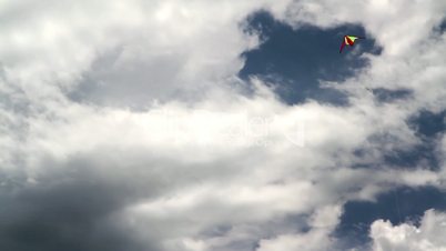 Kite flying in dense cloud.