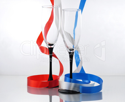 colorful  streamers and two empty glasses