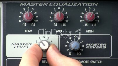 Knob turn; powered audio mixer master level, reverb, equalizer