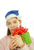 Teen girl wearing Santa hat with a present against white backgro