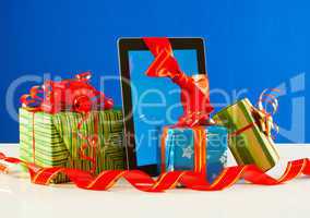 Presents with a tablet pc against blue background