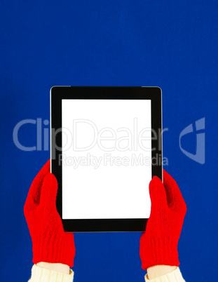 Hands wearing red gloves holding a tablet PC