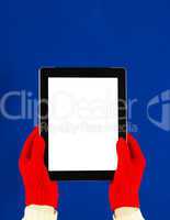 Hands wearing red gloves holding a tablet PC