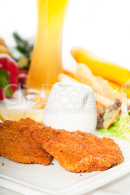 classic Milanese veal cutlets and vegetables