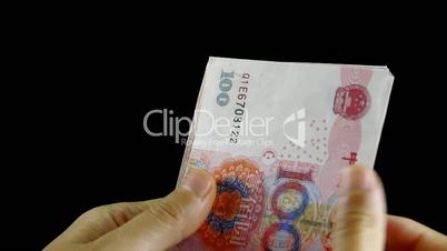 Counting money RMB.