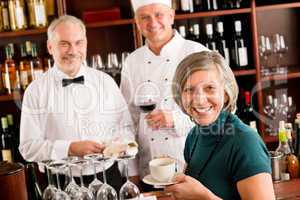 Restaurant smiling manager with staff wine bar