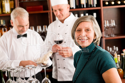 Restaurant manager with staff at wine bar