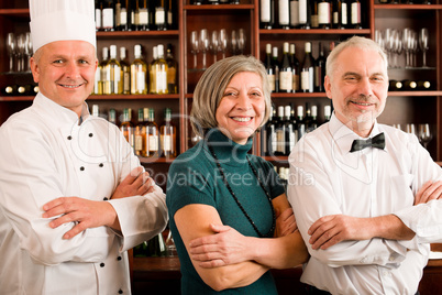 Restaurant manager posing with professional staff